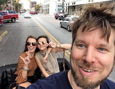 Guests sightseeing in downtown Austin on a pedicab tour